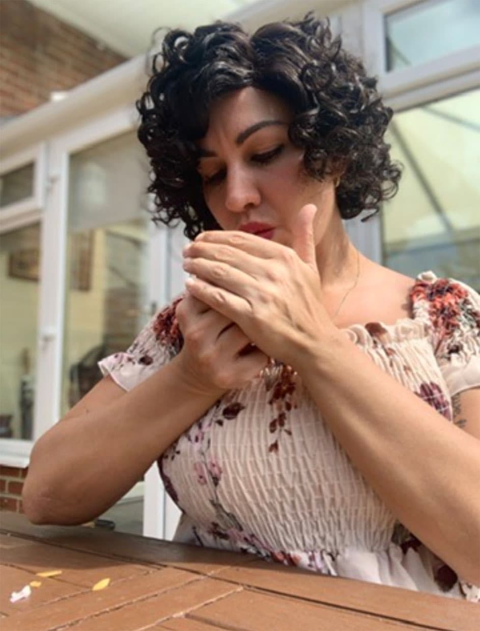 Bianca lighting a cigarette — a habit she later left behind through hypnotherapy